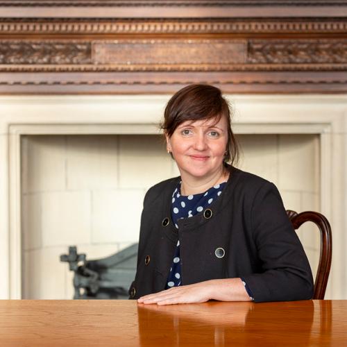 Woman at desk smiling